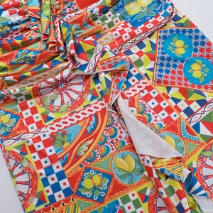 Detail of Mediterranean Sicily print dress featuring lemon motifs and geometric tile patterns