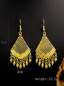Detailed view of bohemian gold tassel earrings with size dimensions and weight info