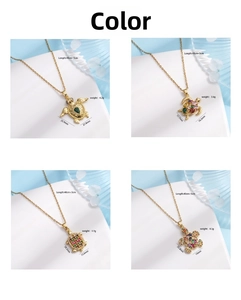 Detail of four turtle necklaces with zirconia inlays, showing size and weight specs