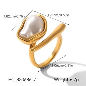 Close-up of golden stainless steel open ring with baroque pearl and size dimensions