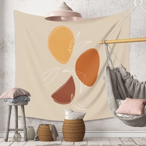 Detail of bohemian tapestry featuring abstract earth-tone shapes and white leaf outlines