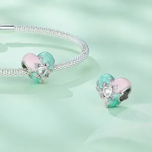 925 sterling silver woven bracelet with pink and green heart-shaped enamel charms