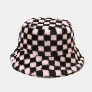 Close-up of pink and black checkerboard plush bucket hat with soft faux fur texture