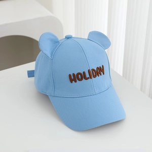 Detail of light blue bear ear baseball cap with brown HOLIDAY embroidery on twill cotton