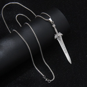 Gothic silver lion head sword pendant necklace for men on a black textured background