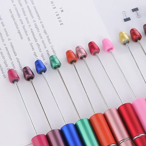 Colorful DIY beaded pens in gradient pastel macaron shades with metallic finish shafts