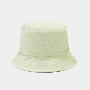 Close-up of mint green terry cloth bucket hat with minimalist white logo embroidery