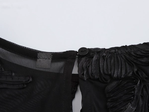 Detailed view of the back collar with transparent mesh and single button closure