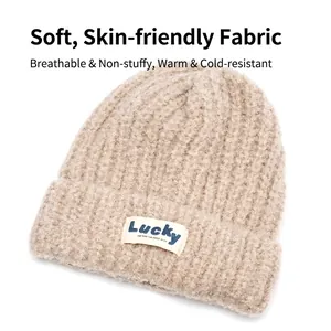 Thick beige chunky knit beanie hat with white Lucky patch for winter warmth