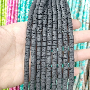 Close-up of black lava stone spacer beads showing natural porous texture for DIY jewelry