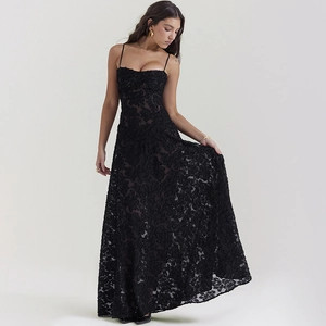 Detail of elegant black long dress showing 3D lace floral texture and slim straps
