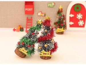 Miniature green and red cedar Christmas trees with snow tips and gold star toppers