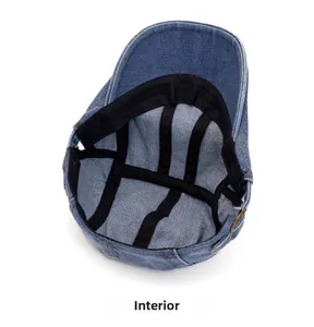 Internal view of washed denim beret featuring contrast stitching and reinforced black ribbon