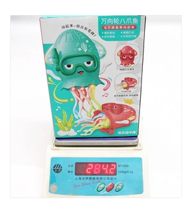 Dancing octopus toy weight measurement showing 284.2g on a scale with retail box
