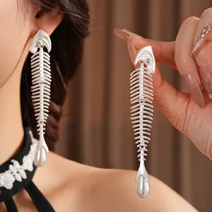 Silver fishbone earrings with sparkling cubic zirconia and drop pearl pendant