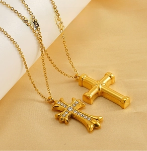 Detail of gold-plated stainless steel cross necklaces with clear crystal pavé setting