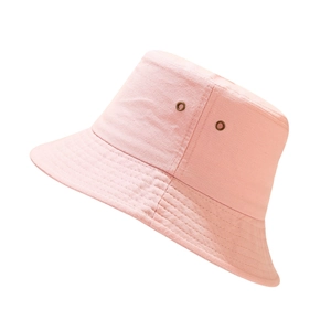 Detail view of pink cotton bucket hat featuring metal eyelets and reinforced stitching