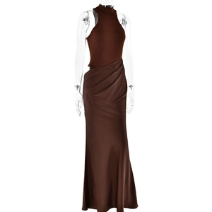 Detail of brown sleeveless halter neck maxi dress with slim fit and pleated skirt design