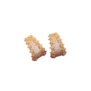 Golden wide C-shaped hoop earrings with sparkling zircons and textured edge design