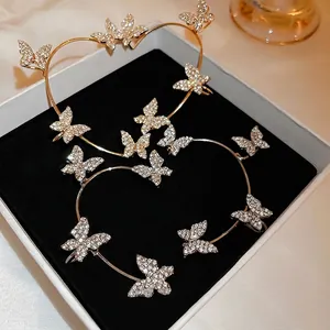 Sparkling butterfly ear cuff set in gold and silver finish with white rhinestones