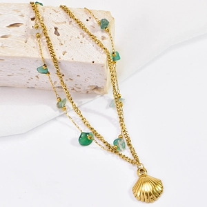 Bohemian gold titanium ankle bracelet with natural green stones and a seashell charm