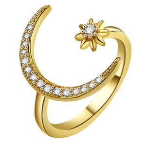 Detail of adjustable gold ring featuring a sparkling moon and star with zircon accents