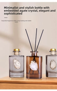 Amber and grey glass reed diffusers with natural agate stone slices and gold edges