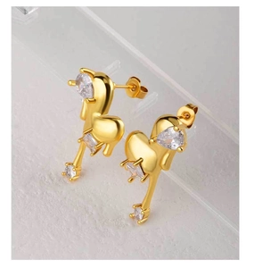 Detailed macro view of 18K gold plated heart earrings with sparkling zircon crystals
