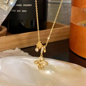 French vintage gold four-leaf clover pendant necklace with sparkling cubic zirconia inlay