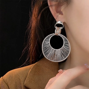 Exaggerated silver hollow circle drop earrings with intricate wire-wrap metal design