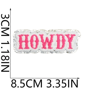 Detail view of pink glitter HOWDY patch embroidery with 8.5cm x 3cm dimension markings