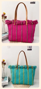 Vertical view of woven tote bags with colorful tassels and textured straw pattern