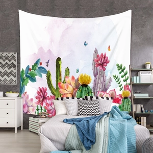 Close-up of bohemian wall tapestry with watercolor cacti and butterflies for bedroom decor