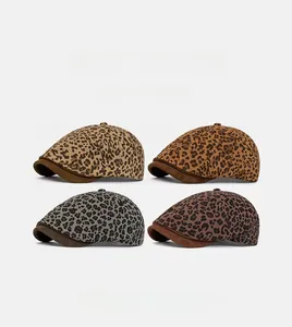 Detail showing four colors of vintage leopard print newsboy caps with suede brims