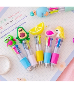 Detailed macro view of 6-color cartoon pens with silicone animal toppers on grid paper