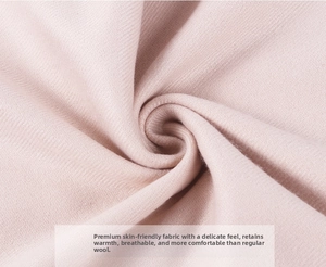 Close-up of soft light pink cashmere scarf fabric with fine twill weave texture