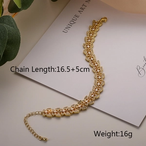 Detailed view of gold butterfly bracelet with zircons and adjustable lobster clasp