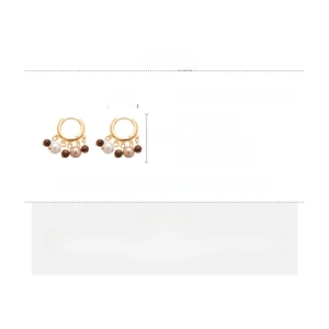Detail showing 18k gold plated earrings with tiger eye beads and pearls, size 2.5cm by 2cm