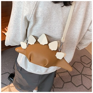Litchi pattern brown dinosaur crossbody bag with white dorsal fins and adjustable strap