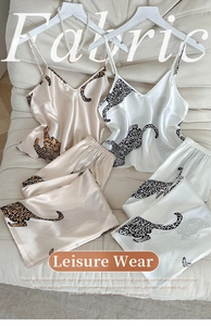Detail of silk satin leopard print sleepwear set with camisole top and matching pants