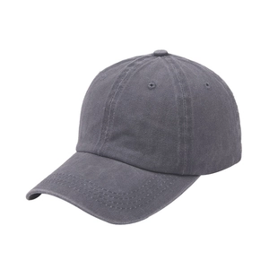 Detailed view of washed charcoal grey cotton twill texture on a minimalist baseball cap