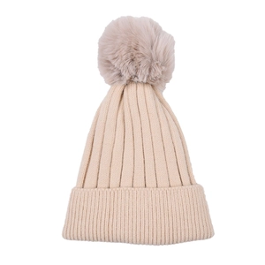 Detail of beige ribbed knit kids hat with thick texture and faux fur pompom