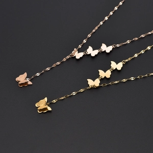 Multi-butterfly pendant necklaces in rose gold and gold finishes with matte textures