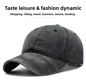 Close-up of the vintage washed dark grey cotton baseball cap with stitched brim and eyelets
