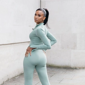 Women's sage green two-piece ribbed sports set with zip-up top and high-waisted leggings