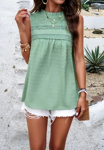 Detail of green sleeveless top featuring a pleated stand collar and lace stitching accents