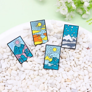 Four-piece seasonal landscape enamel pins featuring mountains, sea, and sunset scenery