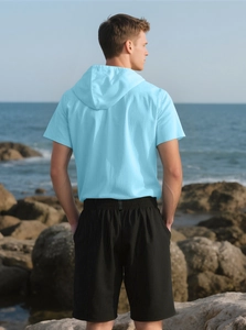 Men's light blue hooded linen shirt and black shorts set shown from the back view