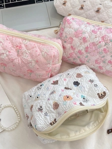 Quilted cotton pouches with floral rabbit and cartoon dog patterns for makeup storage