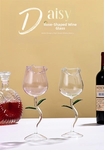 Detail view of rose-shaped wine glass with green leaf stem made of borosilicate glass